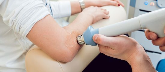 Shockwave therapy being given to the elbow for tennis elbow