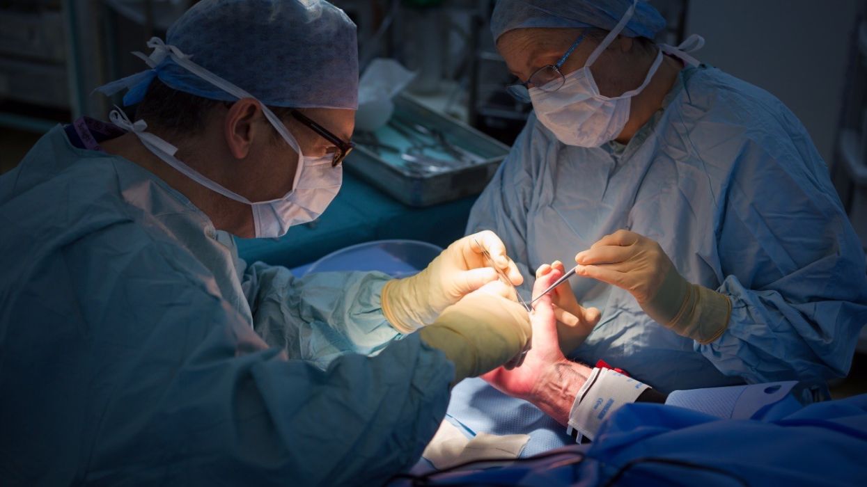 Mr Alistair Jepson operating in theatre