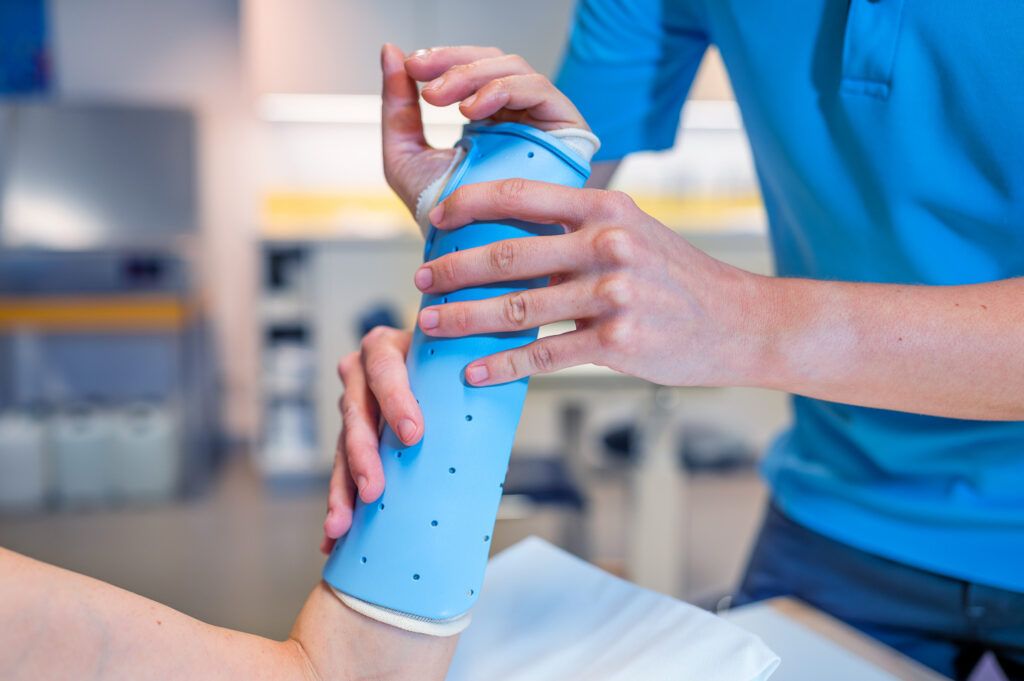 Hand therapist fitting a custom splint